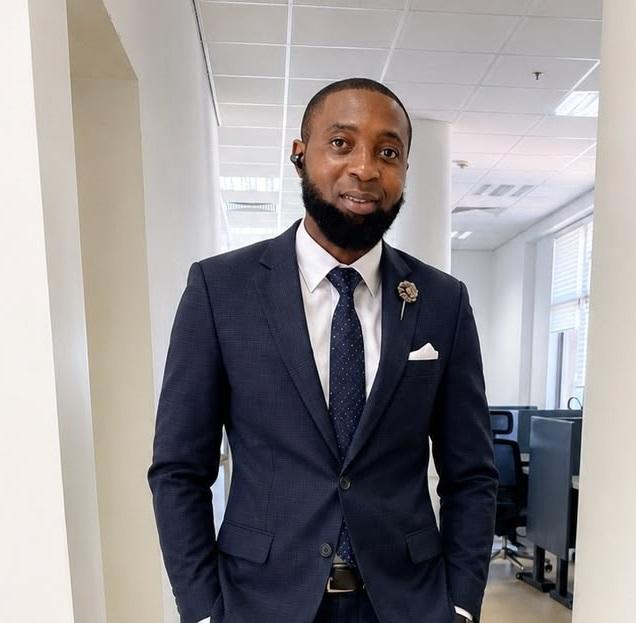 Adebayo Semiu Opeyemi in black suit and tie